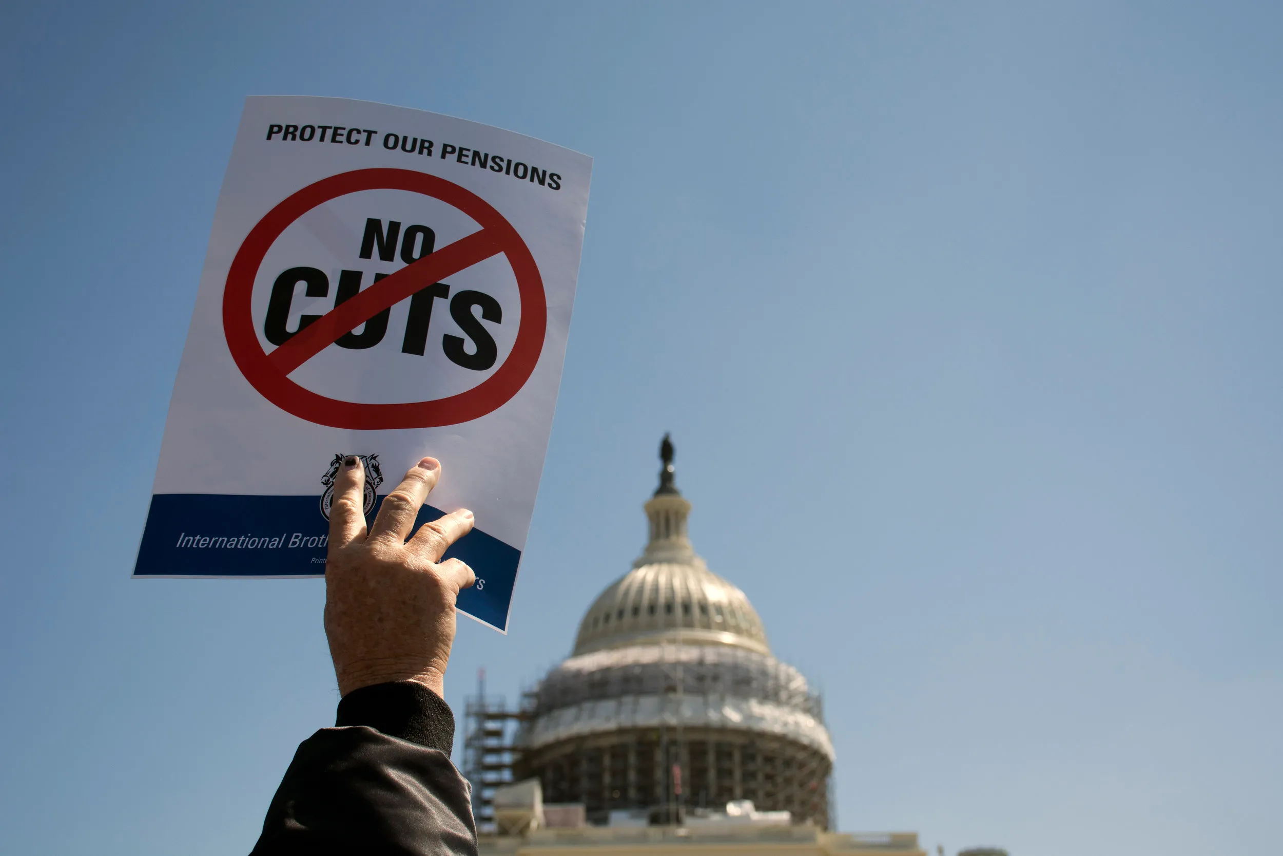 One of the signs brandished at Thursday rally to protest proposed pension cuts for retired teamsters in front of the U.S. Capitol on April, 14, 2016.